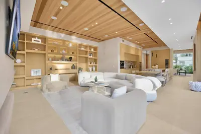 a living room with white couches and a table at Hutton Villa in Los Angeles