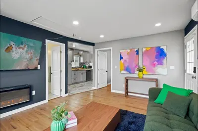 a living room with a couch and a fireplace at Twilight Terrace - Telescope - 15 Min to Beach in Hawthorne