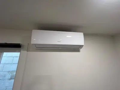a white air conditioner on a ceiling in a room at remodeled 2b 1b house Rosemead c in Rosemead