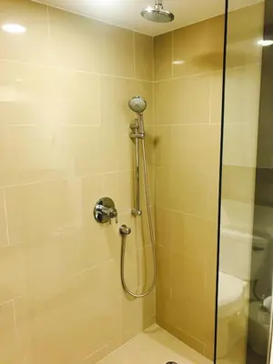 a shower in a bathroom with a glass door at Western and Santa Monica in Los Angeles