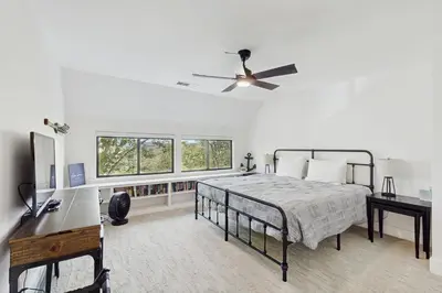 a bedroom with a bed and a ceiling fan at The Kingsview Lakehouse in Lake Arrowhead