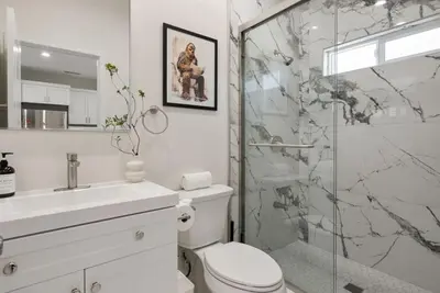 a bathroom with a shower and a toilet and a sink at Darth Vaders Lair - 10 mins to Disney - Sleeps 6 in Anaheim