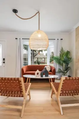 a living room with a couch and a table at Stunning Retro Beach Oasis, Dual Living, Pool in Long Beach