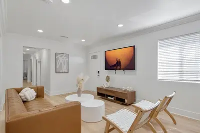 a living room with a couch and a table at Scandinavian Design - Top Unit - Games - Sleeps 10 in Los Angeles