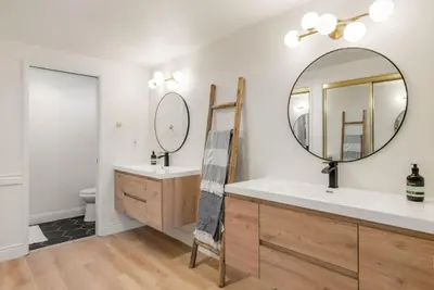 a bathroom with a sink and a mirror at Designer Dream- Pool and spa- Game Room- Sleeps 10 in Los Angeles