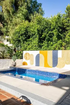 a fence with a swimming pool in a yard at 2-Story Sanctuary - Spacious Hot Tub - Billiards in Los Angeles
