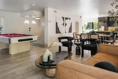 a living room with a couch and a pool table at 2-Story Sanctuary - Spacious Hot Tub - Billiards in Los Angeles