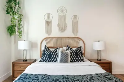 a bedroom with a bed with pillows and two lamps at ArtsDistrictDtLA-2022 BUILT WithVIEWS WD - GARAGE in Los Angeles