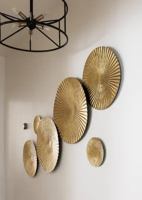 three metal plates on a wall with a chandelier at Iconic LACasita -FoodieBobaliciousCity- Mins2DTLA in Alhambra