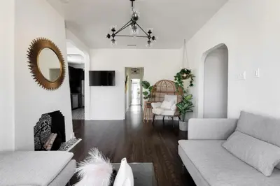 a living room with a couch and a fireplace at Iconic LACasita -FoodieBobaliciousCity- Mins2DTLA in Alhambra