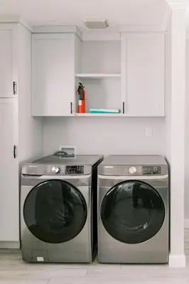 a kitchen with two washing machines in a kitchen at Luxury Hangout - Private Spa - Game Room - Arcade in Long Beach