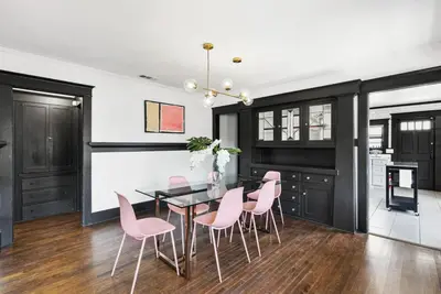 a dining room with pink chairs and a table at HGTV Featured Modern Craftsman Mins2Beach GameRm in Long Beach