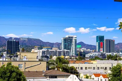 a view of a city with buildings and mountains at Trendy Chic in Los Angeles