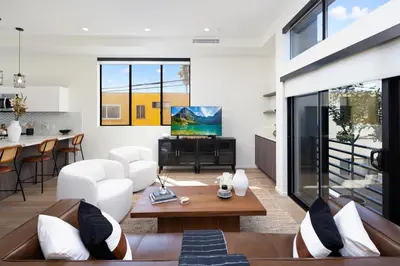 a living room with a couch and a table at Trendy Chic in Los Angeles