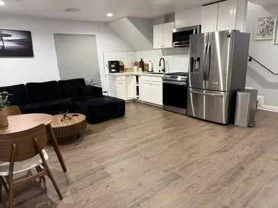 a kitchen and living room with a stainless steel refrigerator at Woodland Hills 1 Bedroom Getaway in Woodland Hills