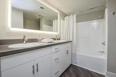 a white bathroom with a sink and a shower at 3BR Apartment Near Santa Monica Pier in Los Angeles