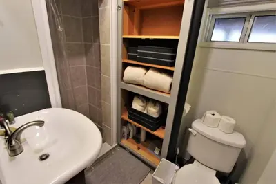 a bathroom with a white toilet and a sink at The Train Getaway Big Bear Lake in Big Bear Lake