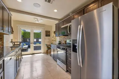 a kitchen with a large stainless steel refrigerator at Historic Heart of Hollywood *Newly Renovated * in Los Angeles