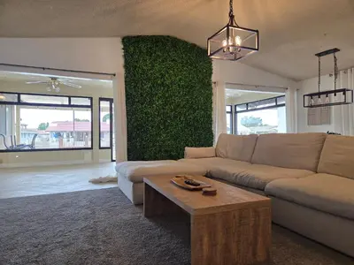 a living room with a couch and a table at Minimalist Lake House in Helendale