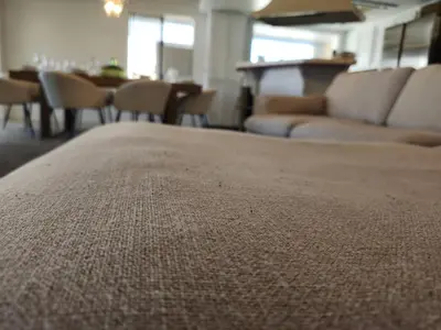 a close up of a couch in a living room at Minimalist Lake House in Helendale