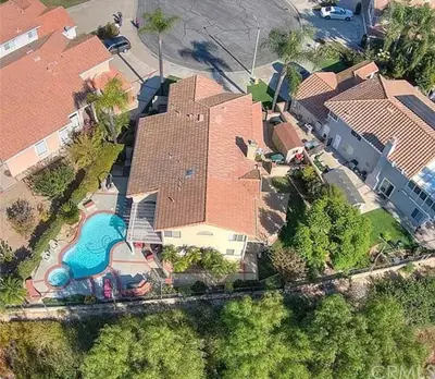 an aerial view of a house with a swimming pool at Mountain View • Pool House in Chino Hills