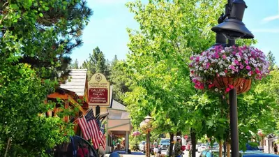 a street in a town with a street light with flowers at Take a Break in Big Bear Lake