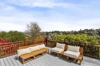 two chairs and a table on a deck with a view at Spectacular Views and Tranquil Retreat in Los Feliz in Los Angeles