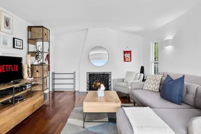 a living room with a couch and a fireplace at Spectacular Views and Tranquil Retreat in Los Feliz in Los Angeles