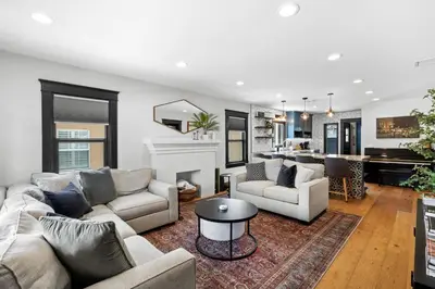 a living room with a couch and a fireplace at Charming 2BR in Heart of LA with Spacious Backyard in Los Angeles