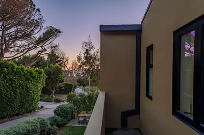 a side view of a house with a window at Private Malibu Escape - Walk to Secluded Beach in Malibu