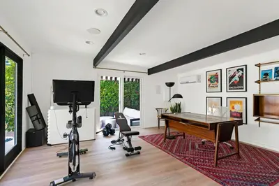 a living room with a ping pong table at Luxury Melrose District 3BR Retreat Pool Spa Gym in Los Angeles