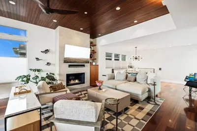 a living room with a couch and a fireplace at Lux by Manhattan Beach Pier and Panoramic Ocean View in Manhattan Beach