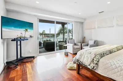 a bedroom with a bed and a view of the ocean at Lux by Manhattan Beach Pier and Panoramic Ocean View in Manhattan Beach