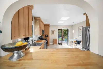 a kitchen with a bowl of fruit on the counter at Atwater Oasis with Pool and HotTub very Walkable Area in Glendale