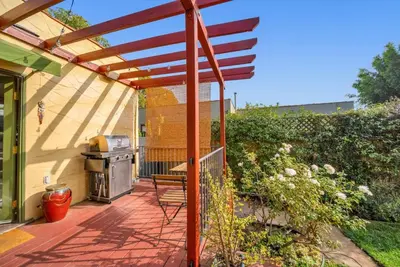 a wooden pergola on a patio with a grill at Atwater Oasis with Pool and HotTub very Walkable Area in Glendale