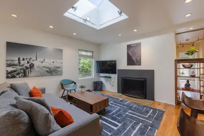 a living room with a couch and a fireplace at Heart of Venice Designer Home Near Abbot Kinney in Los Angeles