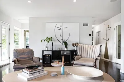 a living room with two chairs and a table at Hollywood Dell Oasis, Canyon VIEWS, Fire Pit and BBQ in Los Angeles