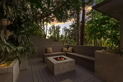 a patio with a couch and a fire pit at Hollywood Dell Oasis, Canyon VIEWS, Fire Pit and BBQ in Los Angeles