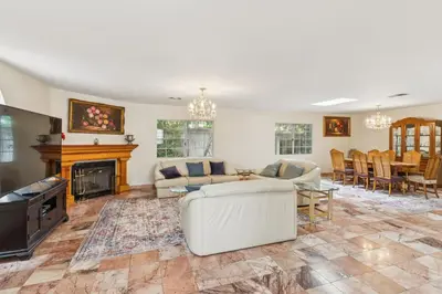 a living room with a couch and a fireplace at Russell House Near Hollywood & Griffith Park home in Los Angeles