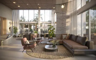 a lobby with a couch and chairs and a table at Level Olympic in Los Angeles