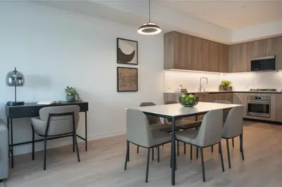 a kitchen and dining room with a table and chairs at Level Olympic in Los Angeles
