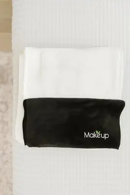 a black and white pillow with a make up sign on it at Charming Casita near USC, SOFI, and Culver City in Los Angeles
