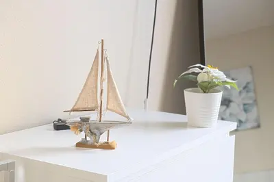 a toy boat sitting on top of a white dresser at Luxe Homestay In Venice in Los Angeles