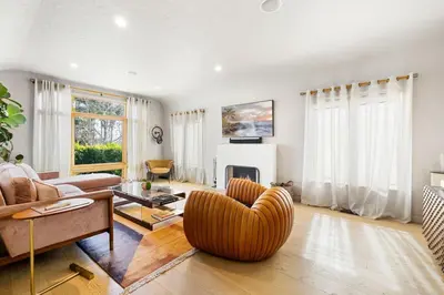 a living room with a couch and a chair at Spanish Bungalow in Trendy Los Feliz For Families in Los Angeles