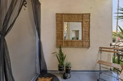 a mirror on a wall in a room at Cozy home in Franklin Village, Central location! in Los Angeles
