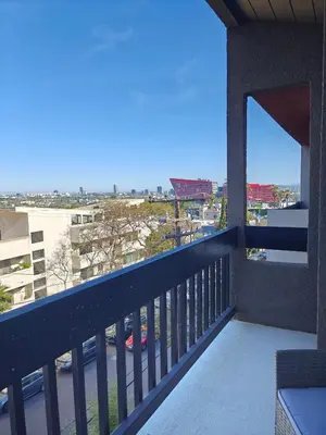 a balcony with a view of a city at Skyline Escape 1-Bedroom with Balcony and Roof-Top Pool in Los Angeles