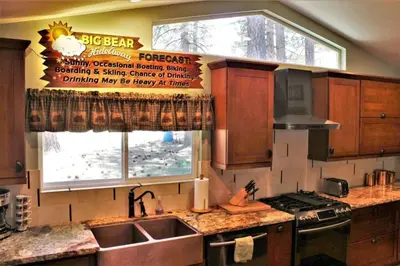 a kitchen with a kitchen sink and a window at Fire Pit & Steps to Village- Village Hideaway in Big Bear Lake