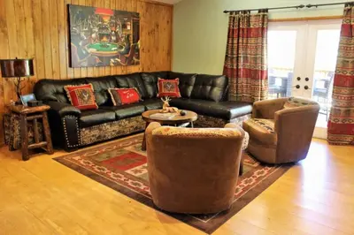 a living room with a leather couch and two chairs at Fire Pit & Steps to Village- Village Hideaway in Big Bear Lake