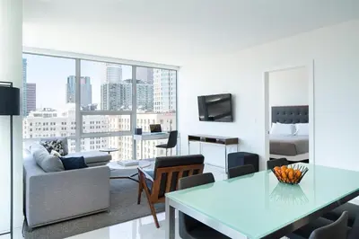 a living room with a couch a table and a bed at 2 Bed 2 Bath Stylish Luxury Premium High-Rise Apartment in Los Angeles