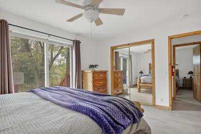 a bedroom with a bed and a ceiling fan at Sea to Ski Retreat in Big Bear Lake